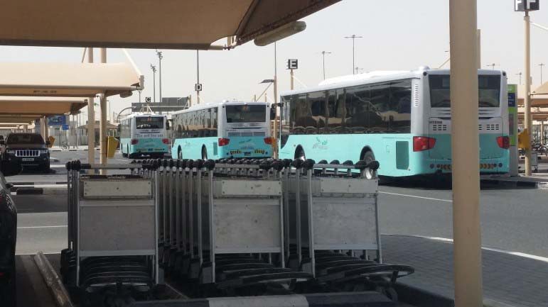 Buses line up to take Doha International Airport staff to the new airport this morning.