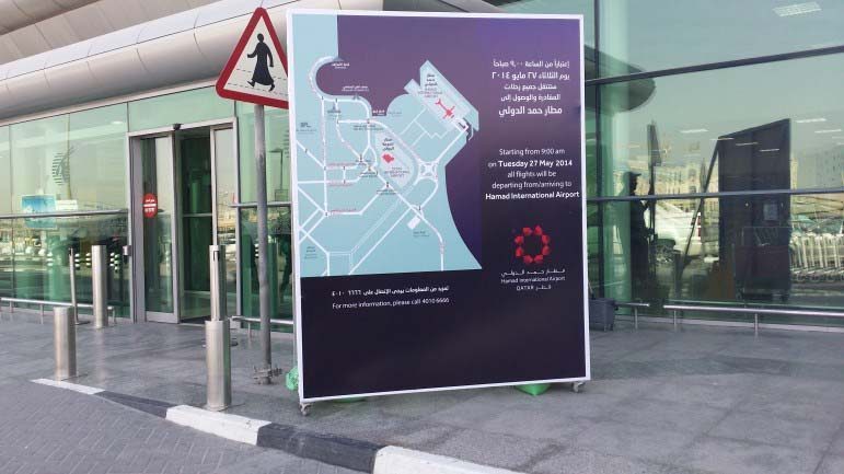 Signage instructs passengers how to get to Hamad International Airport.
