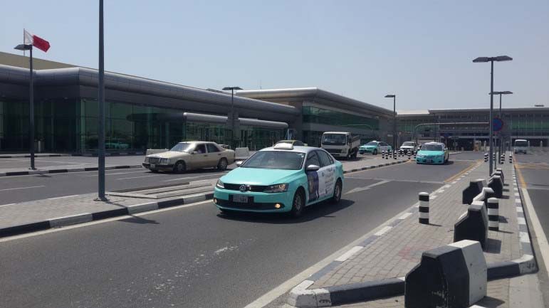 One of a few taxis that could be seen outside of the emptying Doha International Airport this morning.