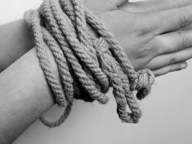 Hands / rope / prisoner / captive / hostage