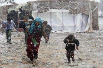 Syrian refugees at a camp during the winter.