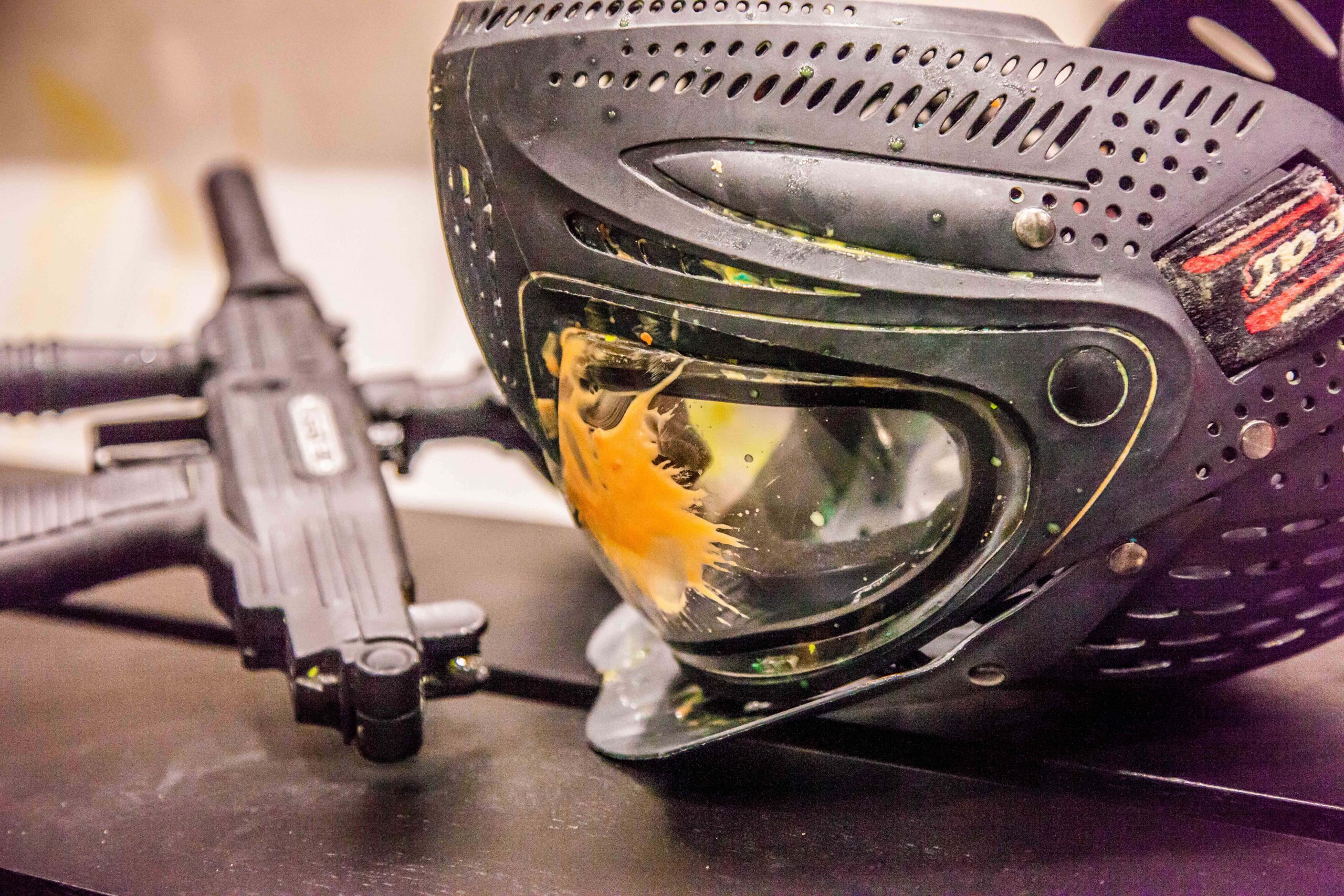 Helmet and guns used for paintball